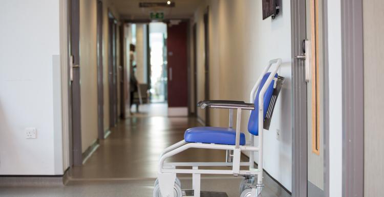 An empty chair in a clinical ward.